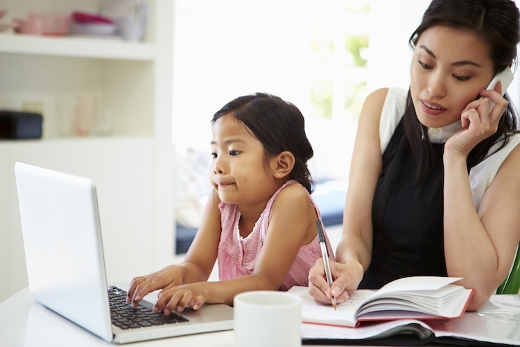 Mom Working From Home With Toddler